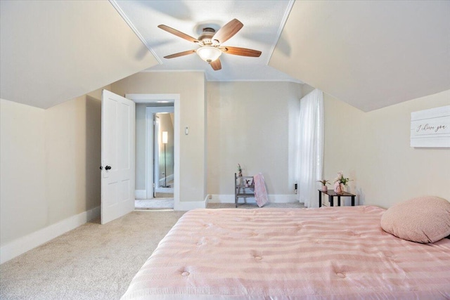 bedroom featuring light carpet, lofted ceiling, and ceiling fan