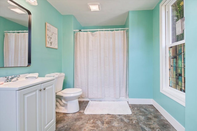 bathroom featuring vanity, a shower with curtain, and toilet