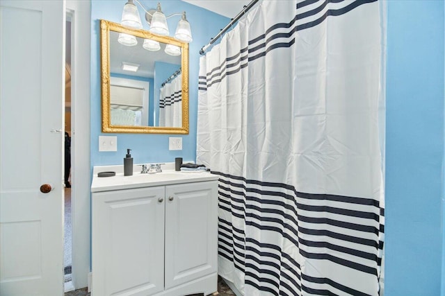 bathroom featuring vanity and a shower with shower curtain