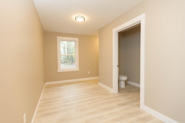 spare room with light wood-type flooring