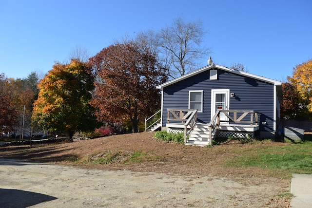 view of front of house featuring a wooden deck