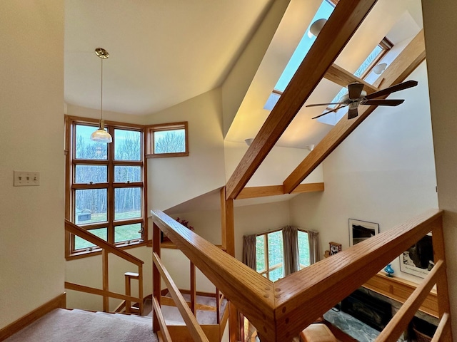6071 Village On The Green Rd Unit G-11, Carrabassett Valley, ME 04947 - stairway with carpet flooring, healthy amount of natural light, baseboards, high vaulted ceiling, and a ceiling fan