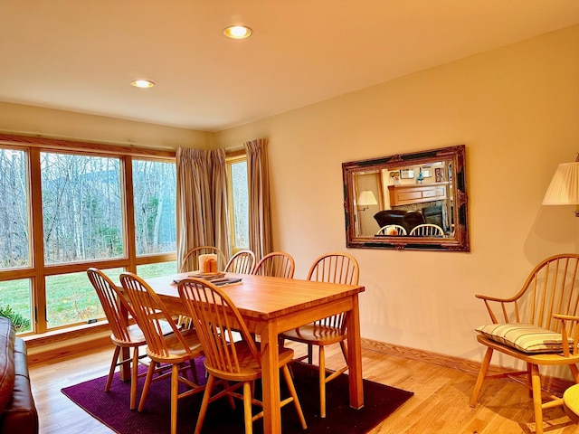 6071 Village On The Green Rd Unit G-11, Carrabassett Valley, ME 04947 - dining room featuring healthy amount of natural light, wood finished floors, recessed lighting, and baseboards