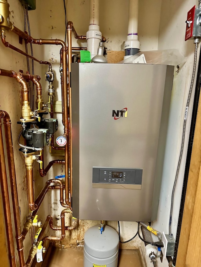 6071 Village On The Green Rd Unit G-11, Carrabassett Valley, ME 04947 - utility room featuring water heater