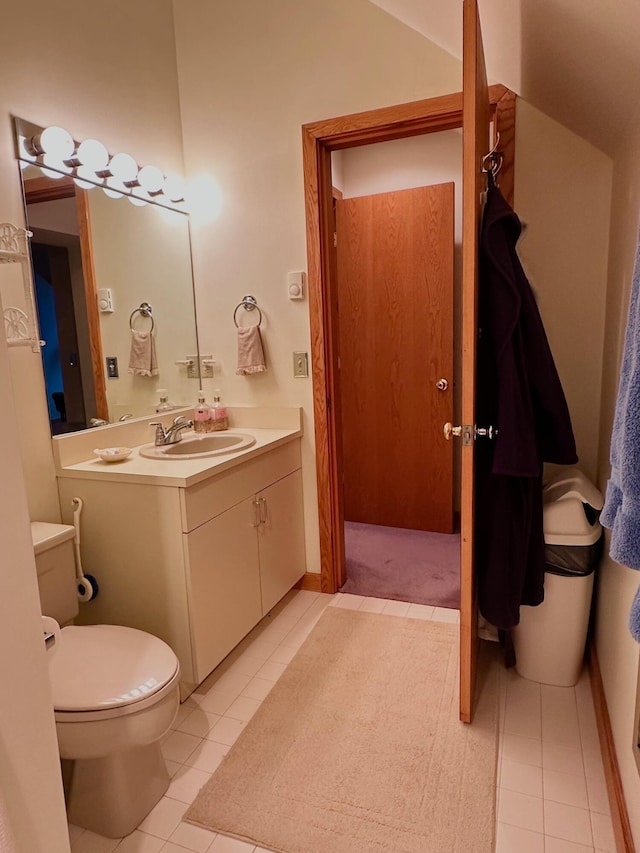 6071 Village On The Green Rd Unit G-11, Carrabassett Valley, ME 04947 - bathroom with vanity, toilet, and tile patterned flooring