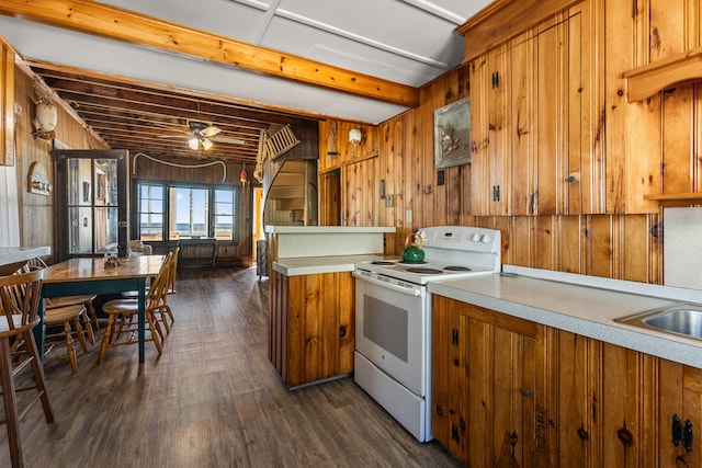 kitchen with wood walls, ceiling fan, white electric range, and dark hardwood / wood-style floors