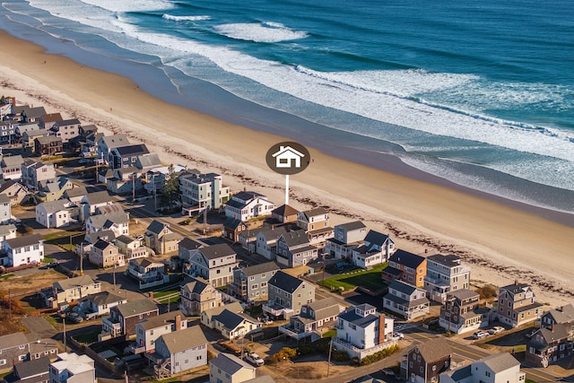 bird's eye view featuring a water view and a view of the beach