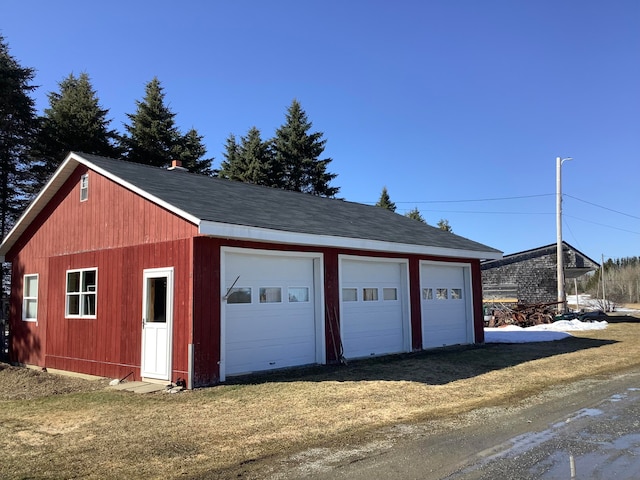 garage with a yard