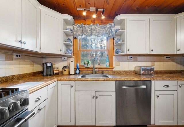 kitchen with white cabinets, appliances with stainless steel finishes, and sink