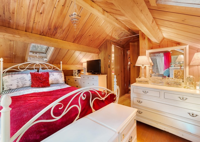 bedroom with lofted ceiling with beams, light hardwood / wood-style floors, wooden walls, and wood ceiling