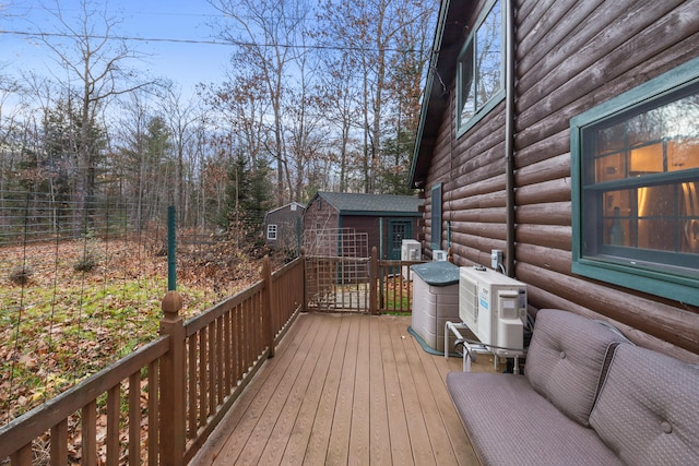 deck with ac unit and an outdoor structure