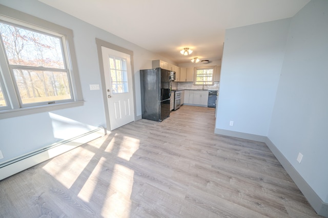 unfurnished living room featuring light hardwood / wood-style floors and a baseboard radiator