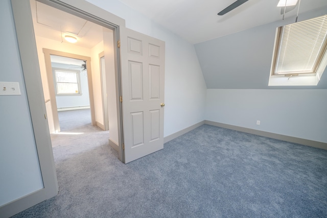 bonus room featuring ceiling fan, carpet flooring, lofted ceiling, and baseboard heating