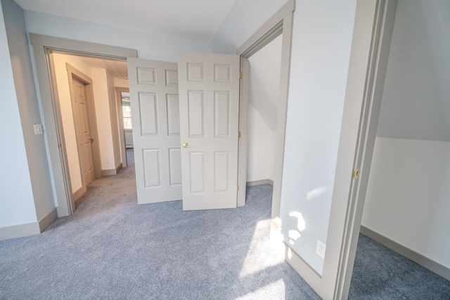 unfurnished bedroom featuring carpet flooring and a closet