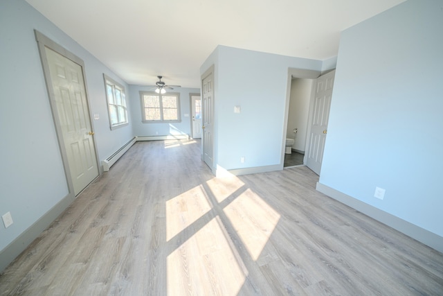 unfurnished living room featuring ceiling fan, a baseboard radiator, and light wood-type flooring