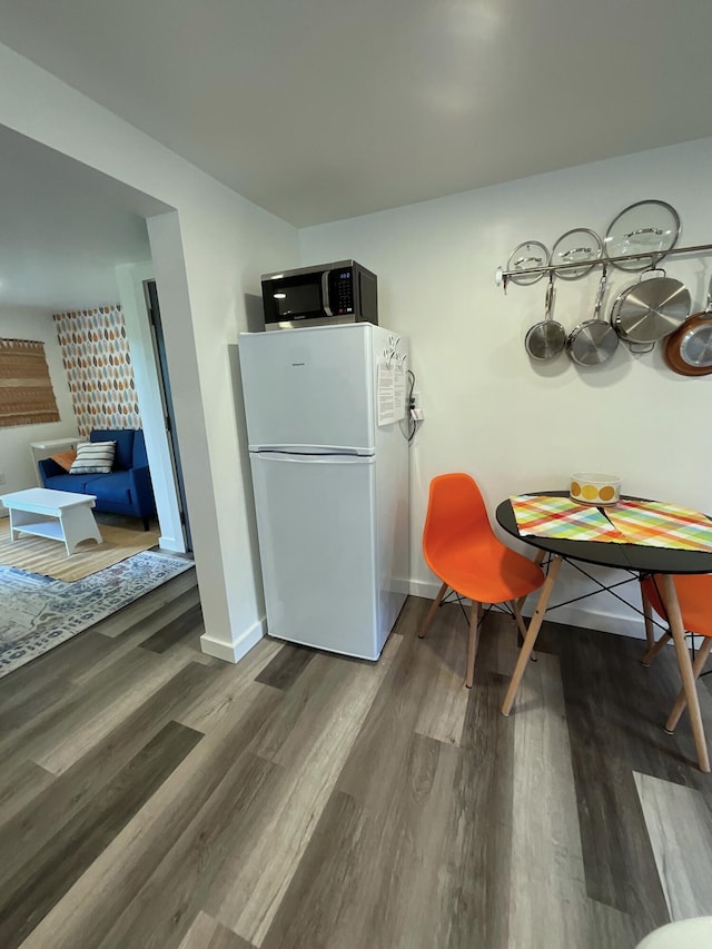 dining area with hardwood / wood-style flooring