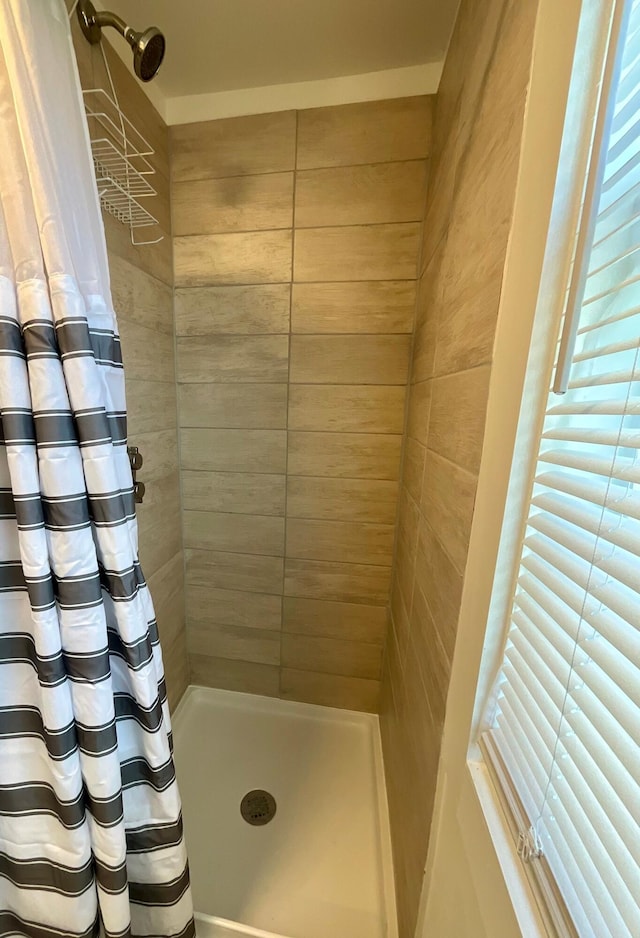 bathroom with a shower with shower curtain