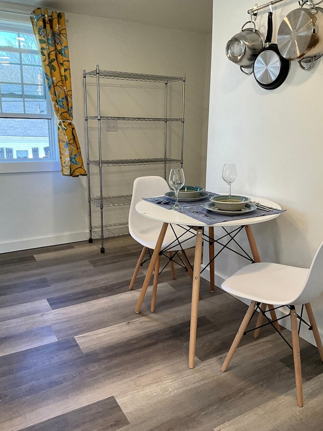 dining area featuring dark hardwood / wood-style floors