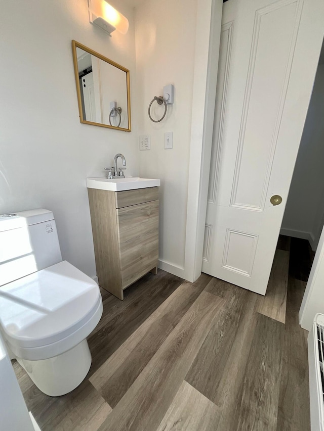 bathroom with hardwood / wood-style flooring and vanity