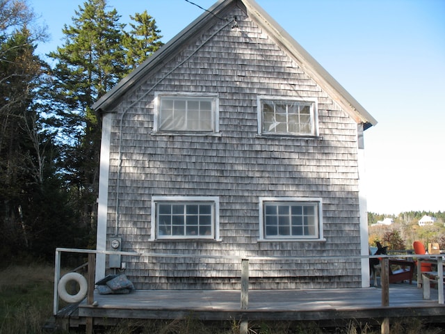 view of home's exterior featuring a wooden deck