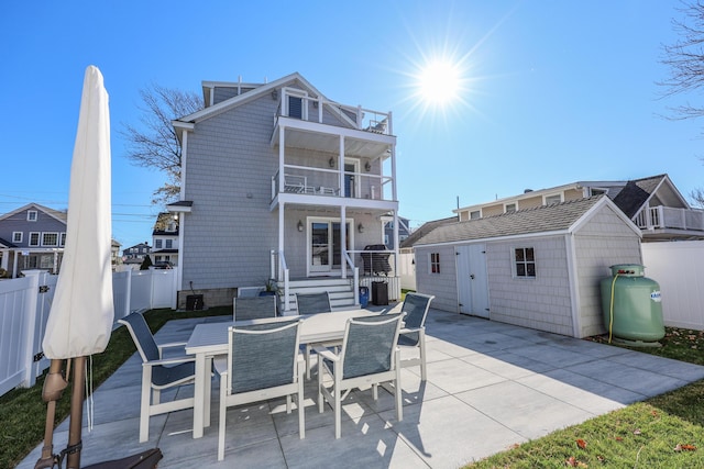167 S Tibbetts Ave, Wells, ME 04090 - rear view of property with a balcony, a patio, and outdoor dining area