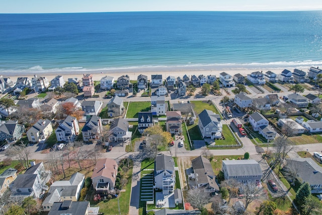 bird's eye view featuring a water view and a view of the beach