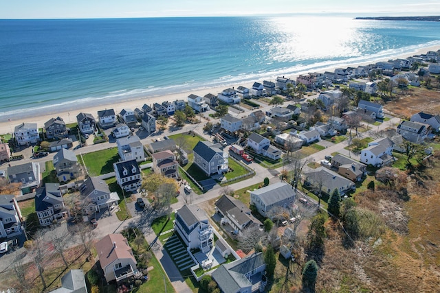 bird's eye view with a water view and a view of the beach