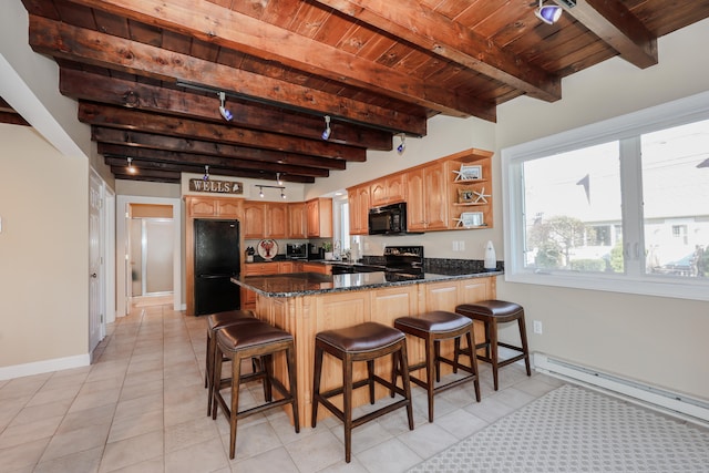 kitchen with light tile patterned flooring, black appliances, beamed ceiling, and kitchen peninsula