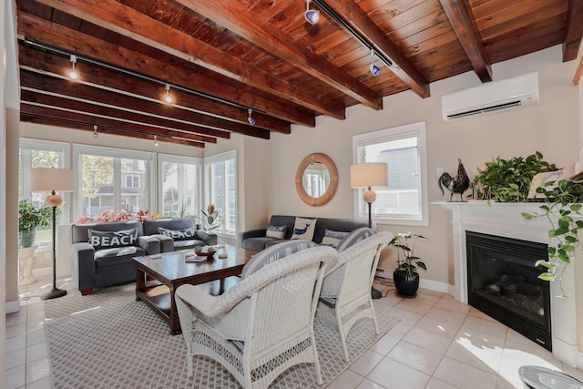 living room with wood ceiling, track lighting, light tile patterned floors, a wall mounted air conditioner, and beamed ceiling