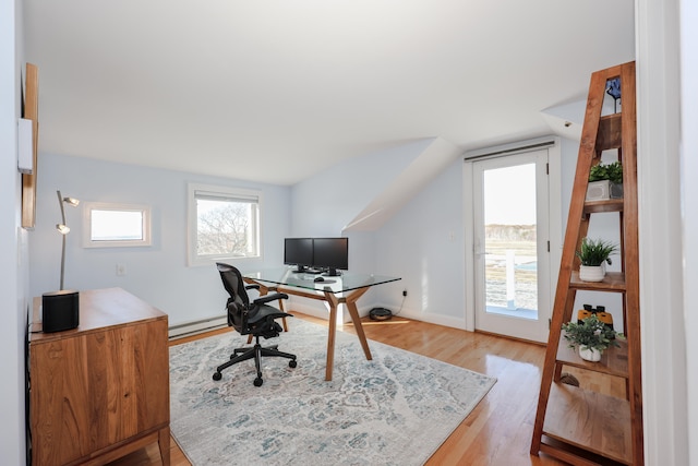 office featuring a baseboard radiator and light hardwood / wood-style flooring