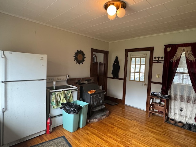 17 York St, Mars Hill, ME 04758 - misc room with a wood stove, crown molding, and hardwood / wood-style floors