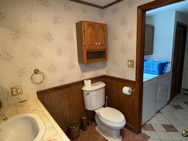 bathroom with wood walls, tile patterned flooring, sink, ornamental molding, and toilet