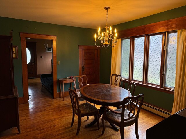 17 York St, Mars Hill, ME 04758 - dining room with baseboard heating, a chandelier, light wood-type flooring, and baseboards