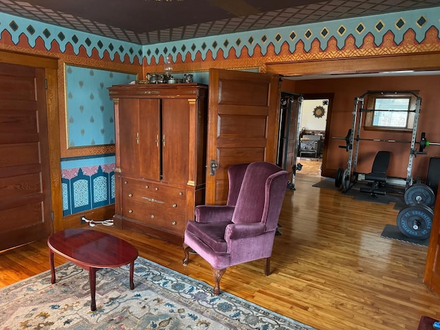 17 York St, Mars Hill, ME 04758 - living area with wallpapered walls and light wood-type flooring