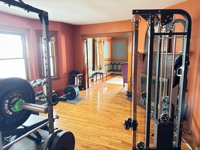 workout area with hardwood / wood-style floors