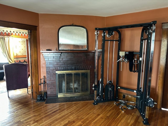 living room with hardwood / wood-style flooring and a fireplace