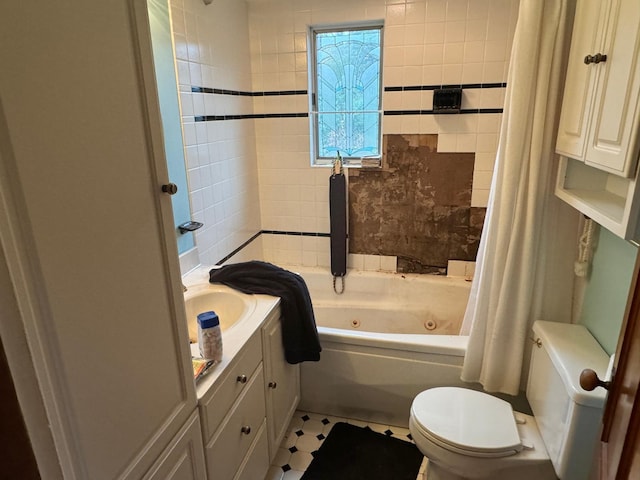 full bathroom with shower / bath combo with shower curtain, tile patterned floors, vanity, and toilet