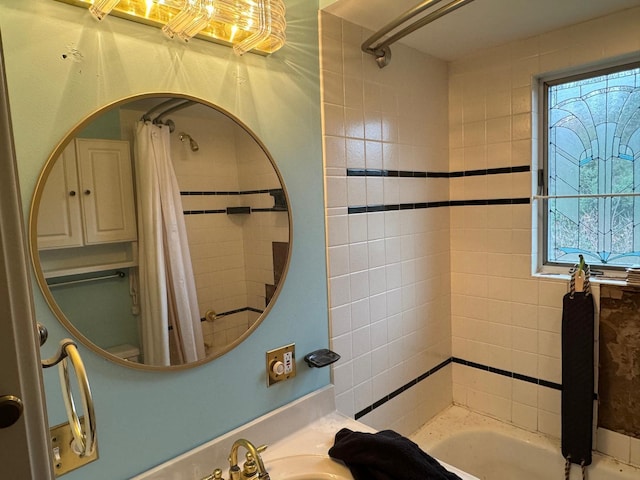 bathroom with shower / tub combo