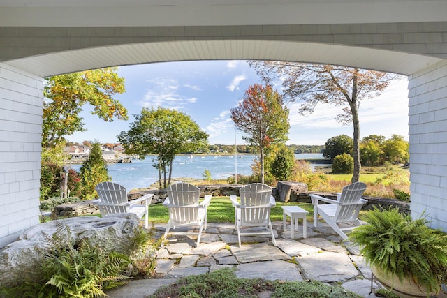 view of patio featuring a water view