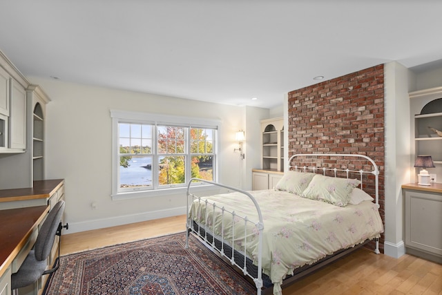 bedroom with light hardwood / wood-style floors