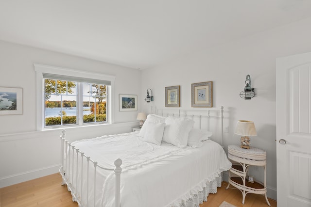 bedroom with light hardwood / wood-style flooring