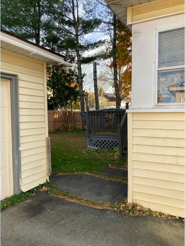 view of gate with a deck