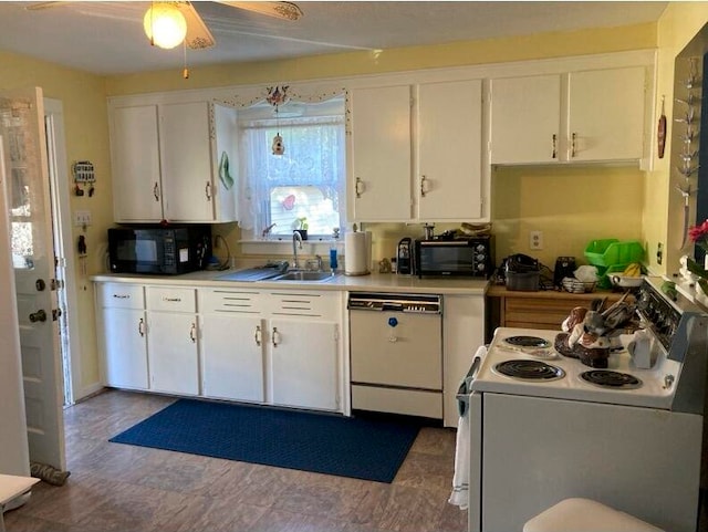 kitchen with white appliances, ceiling fan, sink, and white cabinets