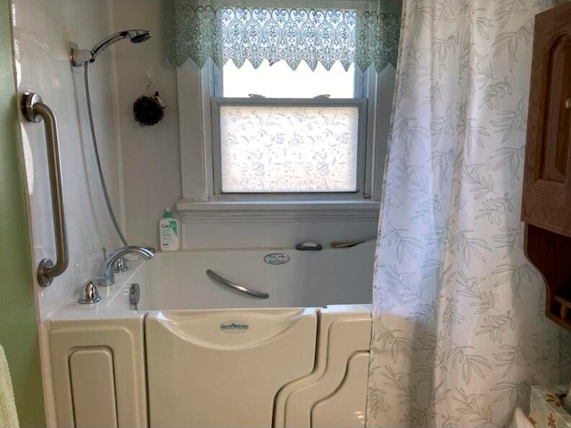 bathroom with separate shower and tub