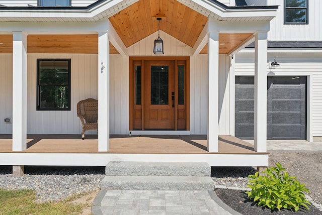 view of exterior entry featuring a porch