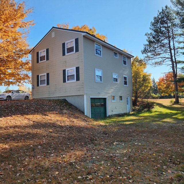 view of side of property with a garage