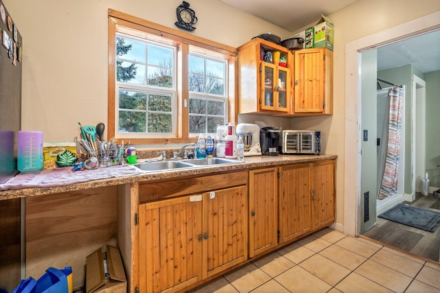 kitchen featuring light wood-type flooring and sink