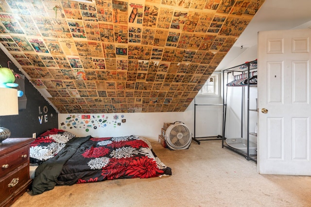 bedroom with vaulted ceiling and carpet flooring