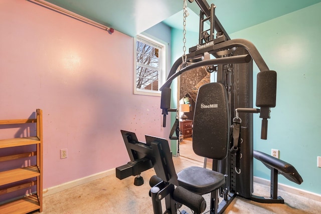 exercise room featuring light colored carpet