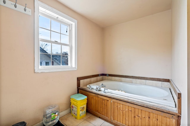 bathroom featuring tile patterned flooring and a tub